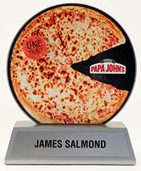 An award designed as a pizza for a Papa John's employee.