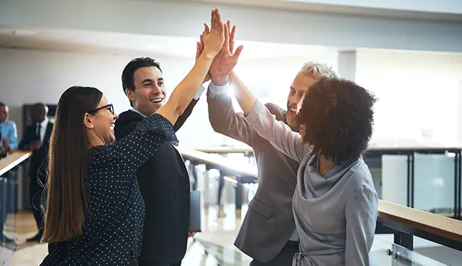 A group of people high-fiving